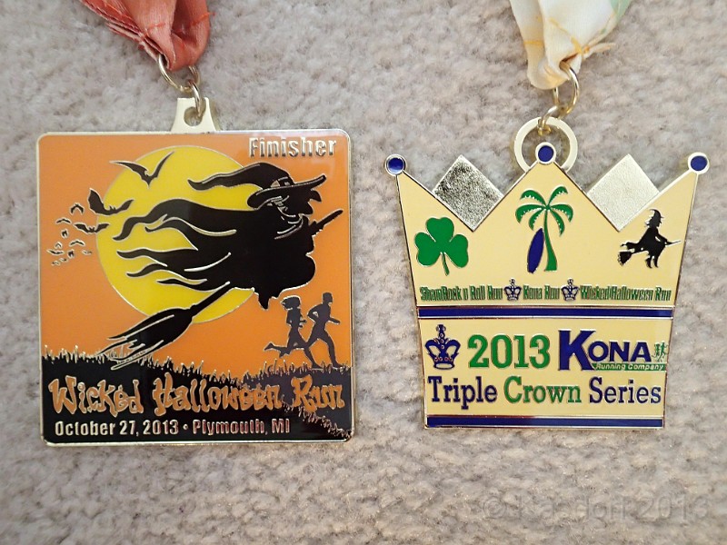 2013 Wicked 10K 295.JPG - The "Triple Crown Series" medal for completing all three races. Personally, a little underwhelmed by it. I would have thought it would be a little bigger than an individual race medal.